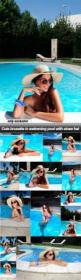 Cute brunette in swimming pool with straw hat - 13 UHQ JPEG