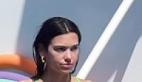 Slim Stunner Dua Lipa Showing Her Physique in a Mismatched Colorful Bikini
